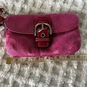 Hot pink Coach wallet with strap